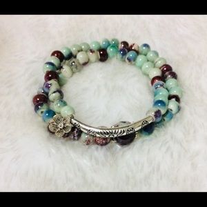 Beautiful green bracelet with a metal flower
